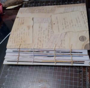 Side view of journal showing slack binding stitches. 